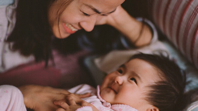 mom looking at young baby